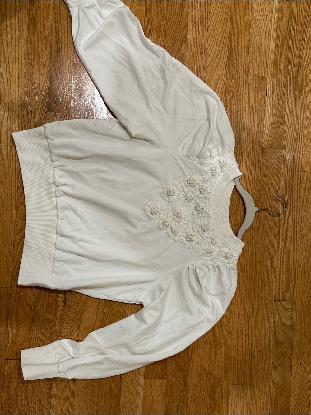 Anthropologie Lovely Cream Puff-Sleeve Sweatshirt with Floral pinch detailing.